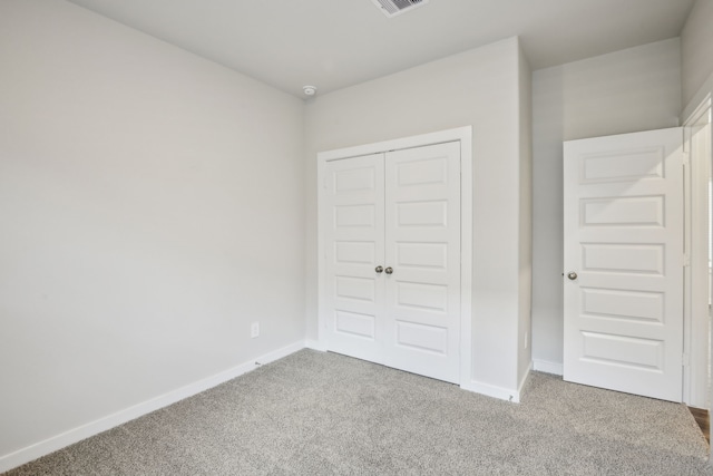 18717 Bliss Pl, New Caney, TX 77357 - unfurnished bedroom with carpet flooring, a closet, and baseboards