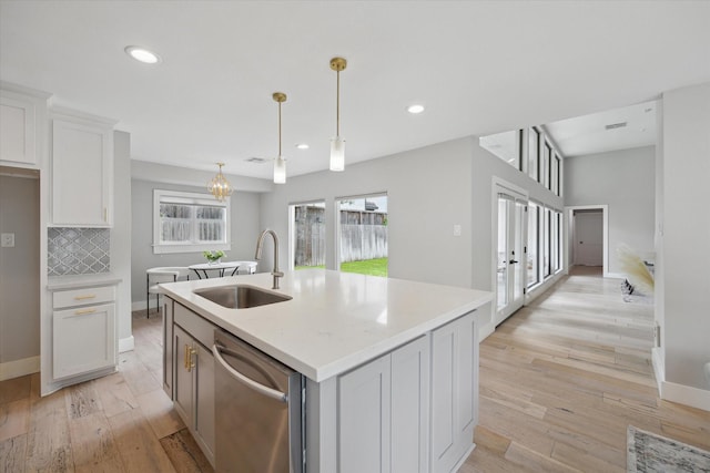 625 Rancho Bauer Dr, Houston, TX 77079 - kitchen featuring a sink, stainless steel dishwasher, light wood-style floors, white cabinets, and recessed lighting