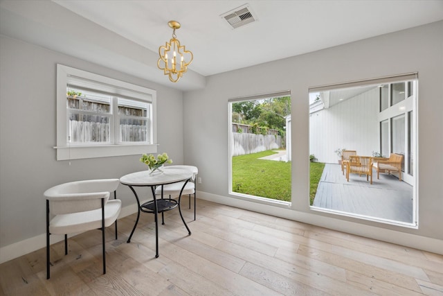 625 Rancho Bauer Dr, Houston, TX 77079 - dining space featuring a chandelier, wood finished floors, and baseboards