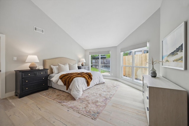625 Rancho Bauer Dr, Houston, TX 77079 - bedroom featuring light wood-type flooring, baseboards, and high vaulted ceiling