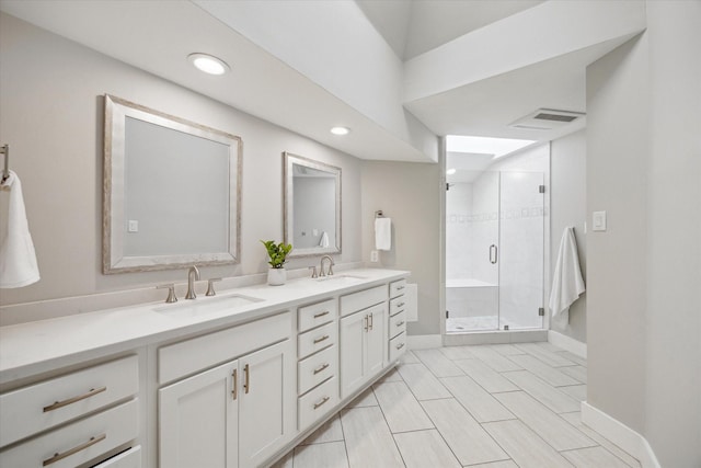 625 Rancho Bauer Dr, Houston, TX 77079 - bathroom with double vanity, recessed lighting, a shower stall, and baseboards