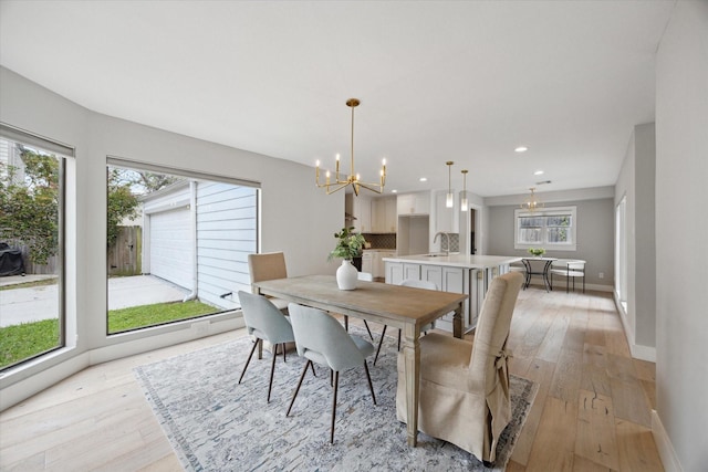 625 Rancho Bauer Dr, Houston, TX 77079 - dining space featuring a chandelier, light wood-style floors, baseboards, and recessed lighting
