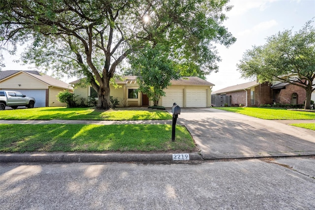 2219 Anthony Hay Ln, Katy, TX 77449 - ranch-style house with concrete driveway, a front lawn, and a garage