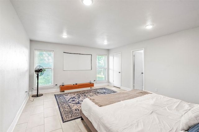2219 Anthony Hay Ln, Katy, TX 77449 - bedroom featuring multiple windows, light tile patterned floors, baseboards, and recessed lighting