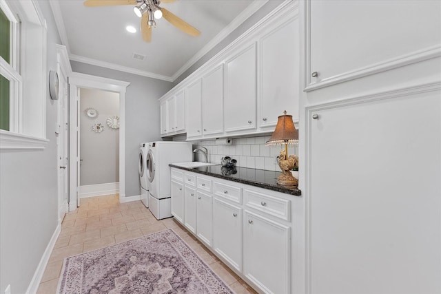 37922 Clubhouse Ln, Magnolia, TX 77355 - clothes washing area with cabinet space, washer and dryer, ceiling fan, baseboards, and ornamental molding