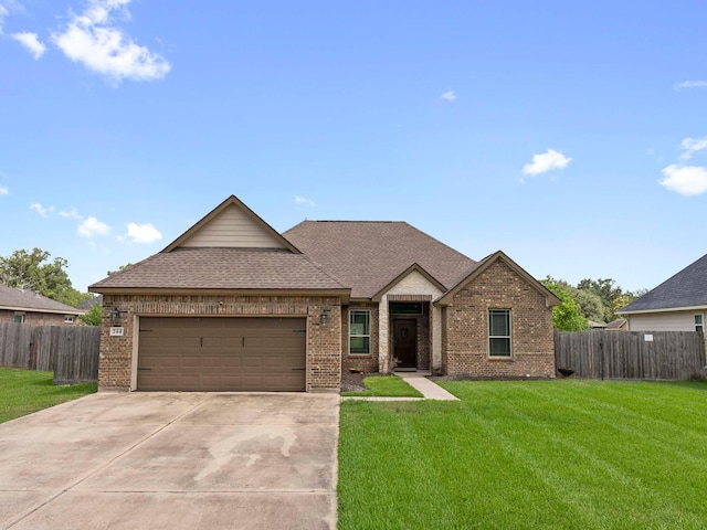244 Mossy Meadow Dr, West Columbia, TX 77486 - view of front of property with brick siding, an attached garage, driveway, and a shingled roof