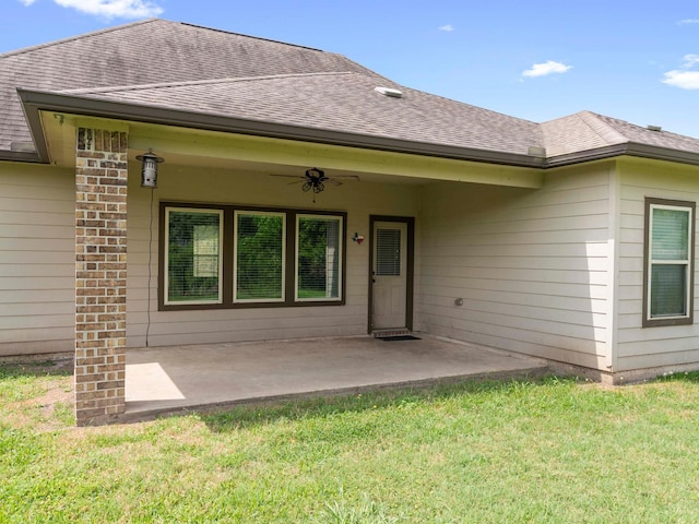 244 Mossy Meadow Dr, West Columbia, TX 77486 - rear view of house with a shingled roof, a ceiling fan, a yard, and a patio
