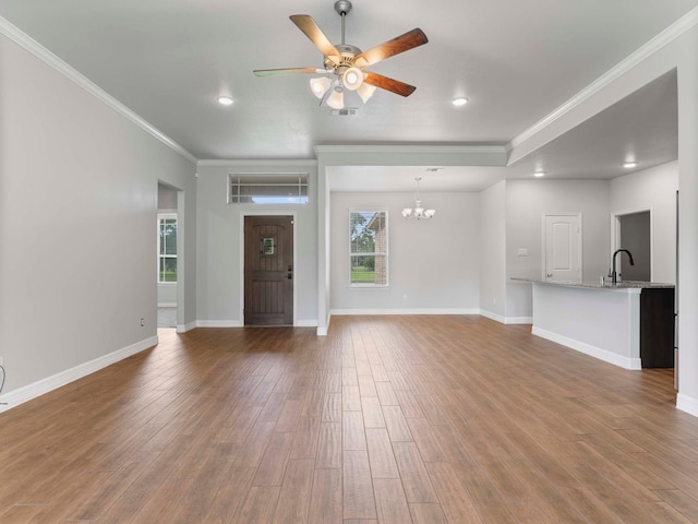 244 Mossy Meadow Dr, West Columbia, TX 77486 - unfurnished living room featuring ornamental molding, a ceiling fan, wood finished floors, a chandelier, and recessed lighting