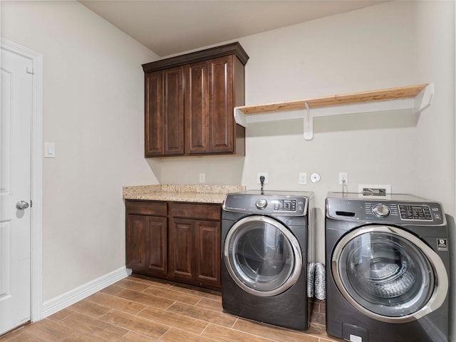 244 Mossy Meadow Dr, West Columbia, TX 77486 - washroom with washing machine and dryer, cabinet space, light wood-type flooring, and baseboards