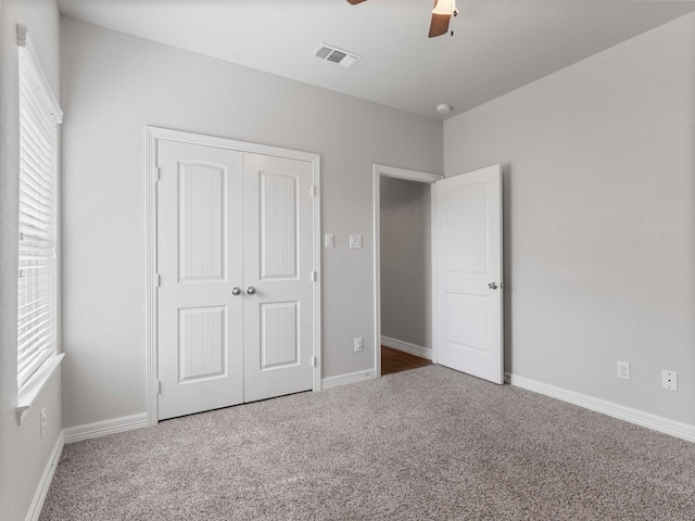 244 Mossy Meadow Dr, West Columbia, TX 77486 - unfurnished bedroom featuring carpet flooring, a closet, a ceiling fan, and baseboards