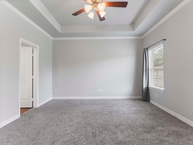244 Mossy Meadow Dr, West Columbia, TX 77486 - carpeted empty room with a tray ceiling, ceiling fan, and baseboards
