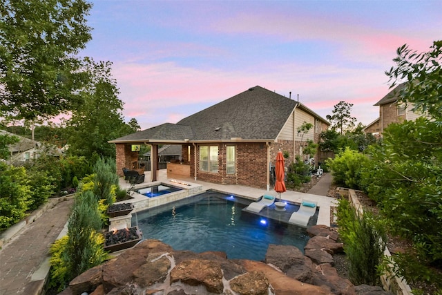 6 Muthill Cir, Conroe, TX 77304 - swimming pool featuring an outdoor kitchen, a patio, and an in-ground hot tub