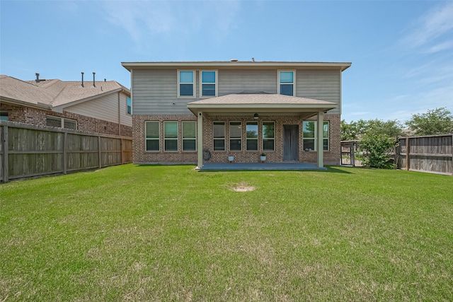 2822 Bluesage Bluff Dr, Richmond, TX 77406 - rear view of house with brick siding and a patio area