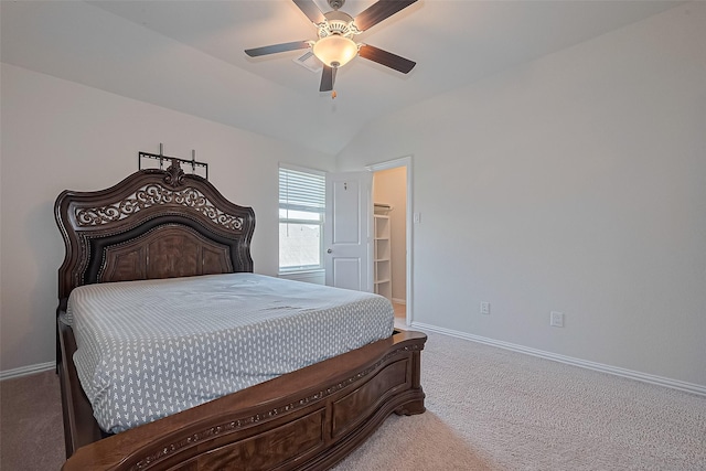2822 Bluesage Bluff Dr, Richmond, TX 77406 - carpeted bedroom with baseboards, lofted ceiling, ceiling fan, and a walk in closet