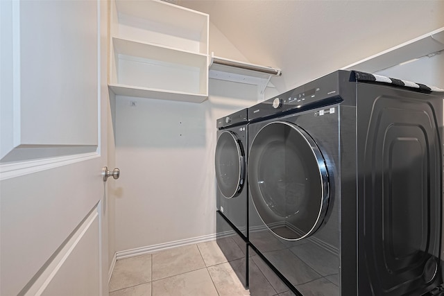 2822 Bluesage Bluff Dr, Richmond, TX 77406 - washroom with washing machine and dryer, light tile patterned floors, and baseboards