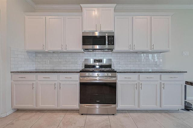 2822 Bluesage Bluff Dr, Richmond, TX 77406 - kitchen with stainless steel appliances, white cabinets, dark stone counters, crown molding, and backsplash