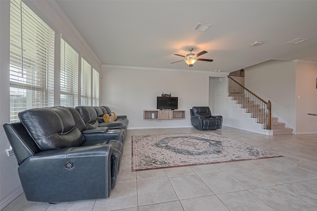 2822 Bluesage Bluff Dr, Richmond, TX 77406 - living area with stairs, light tile patterned floors, a ceiling fan, crown molding, and baseboards