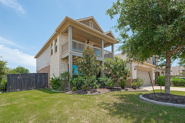 2822 Bluesage Bluff Dr, Richmond, TX 77406 - view of front of house featuring a balcony, brick siding, driveway, and stone siding