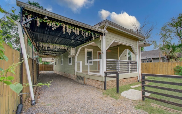 2711 Maury St, Houston, TX 77009 - view of front of house with an attached carport and a fenced backyard