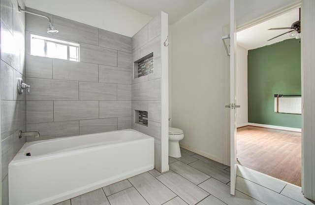 2711 Maury St, Houston, TX 77009 - full bath featuring toilet, ceiling fan, a tile fireplace, shower / washtub combination, and baseboards