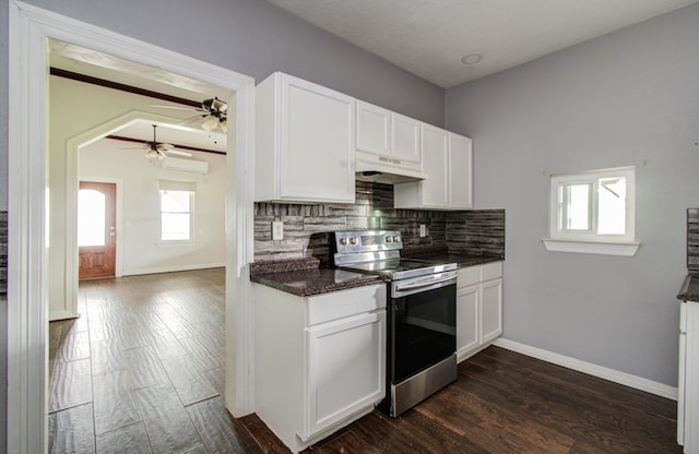 2711 Maury St, Houston, TX 77009 - kitchen featuring stainless steel range with electric cooktop, dark countertops, backsplash, under cabinet range hood, and ceiling fan