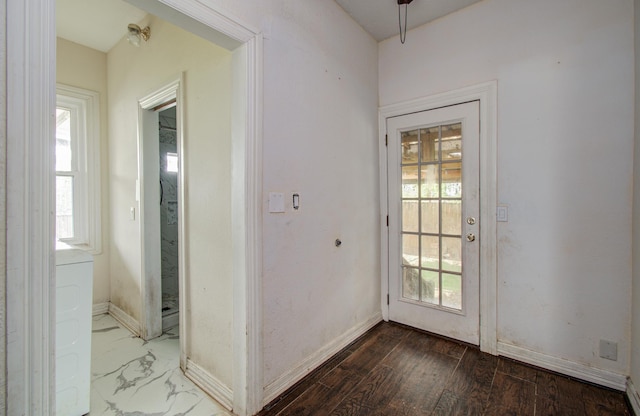 2711 Maury St, Houston, TX 77009 - doorway featuring healthy amount of natural light and baseboards