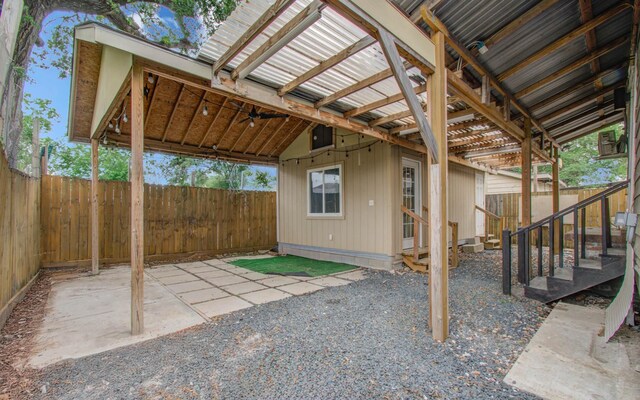 2711 Maury St, Houston, TX 77009 - view of patio featuring a fenced backyard, ceiling fan, and entry steps
