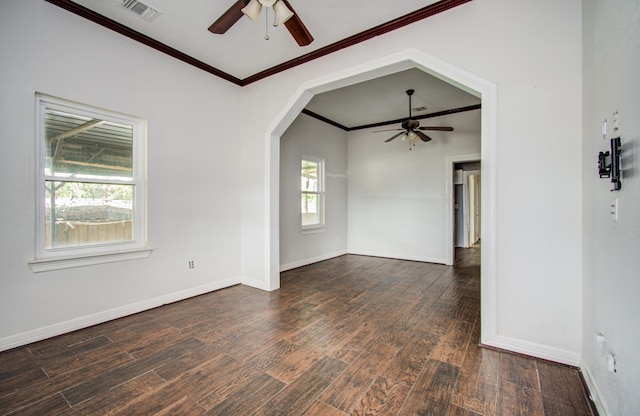 2711 Maury St, Houston, TX 77009 - spare room featuring ceiling fan, dark wood-style flooring, ornamental molding, and baseboards