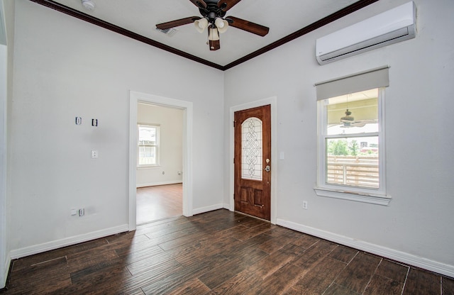 2711 Maury St, Houston, TX 77009 - foyer featuring a wall mounted air conditioner, crown molding, ceiling fan, wood finished floors, and baseboards