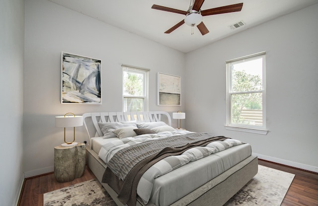 2711 Maury St, Houston, TX 77009 - bedroom with baseboards, dark wood-type flooring, and ceiling fan