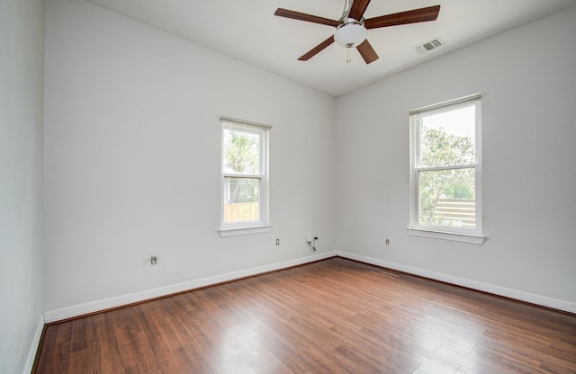 2711 Maury St, Houston, TX 77009 - spare room featuring wood finished floors, a ceiling fan, and baseboards