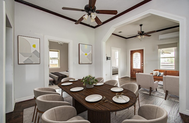 2711 Maury St, Houston, TX 77009 - dining room featuring a ceiling fan, wood finished floors, ornamental molding, baseboards, and a wall unit AC