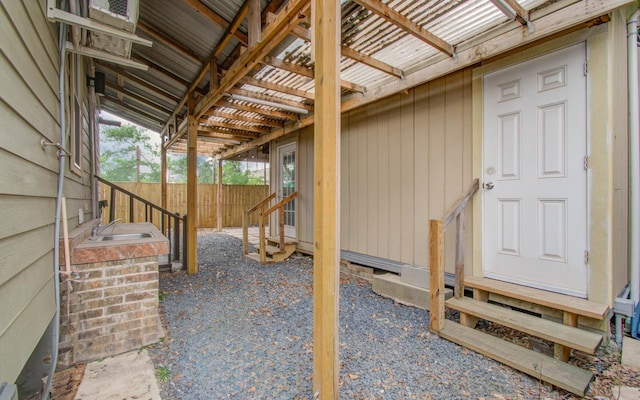 2711 Maury St, Houston, TX 77009 - view of patio featuring entry steps, fence, and a sink