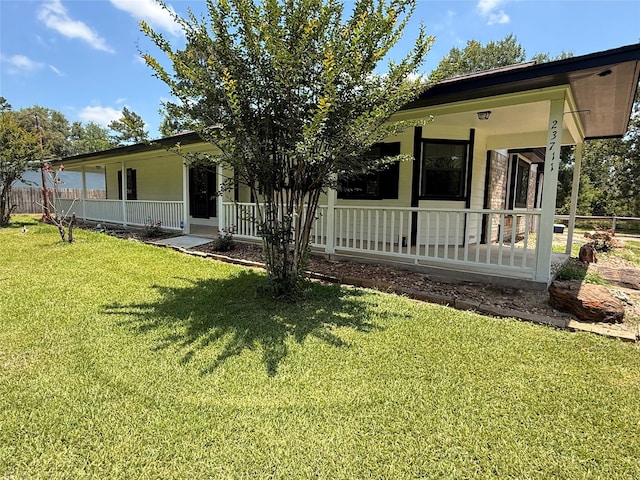 23711 Saxon Way, Hockley, TX 77447 - view of front of home with a porch and a front lawn