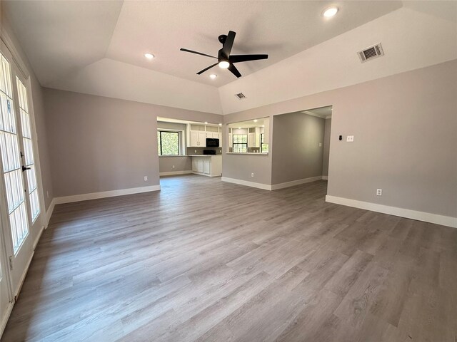 23711 Saxon Way, Hockley, TX 77447 - unfurnished living room featuring a ceiling fan, baseboards, wood finished floors, lofted ceiling, and recessed lighting