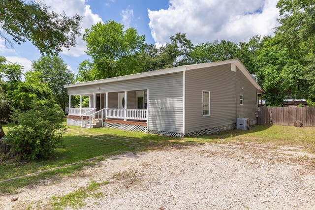 240 7th St, Trinity, TX 75862 - view of front of home featuring covered porch and central AC unit