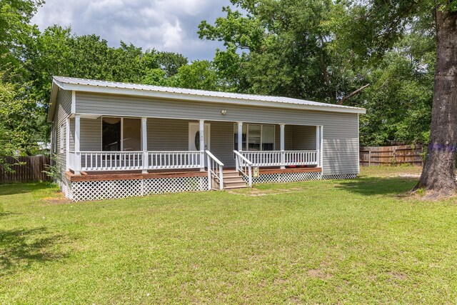 240 7th St, Trinity, TX 75862 - view of front of home with covered porch and metal roof