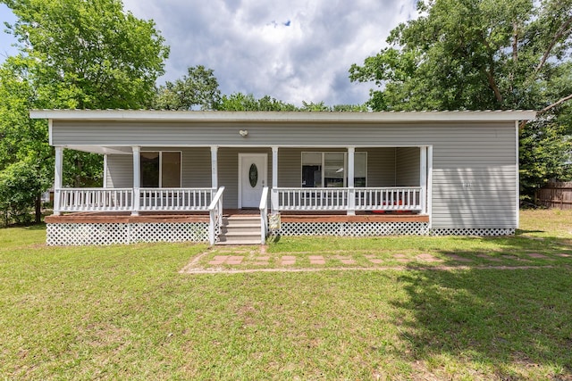 240 7th St, Trinity, TX 75862 - view of front of home featuring a porch and a front lawn