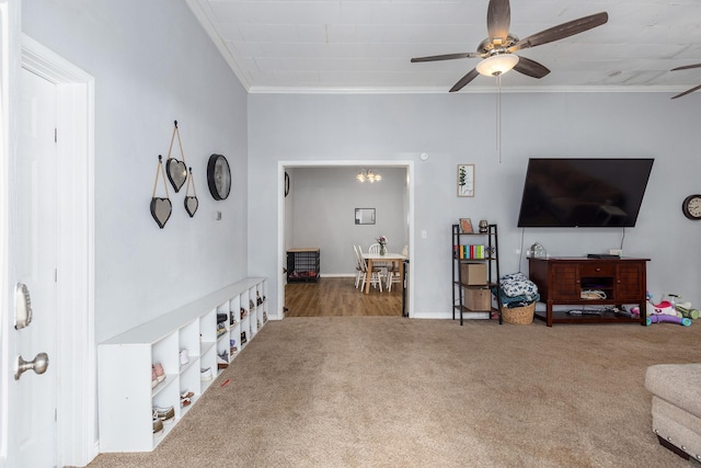 240 7th St, Trinity, TX 75862 - living room featuring carpet floors, a ceiling fan, ornamental molding, and baseboards
