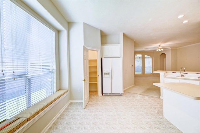 bathroom with ceiling fan, baseboards, a sink, and recessed lighting