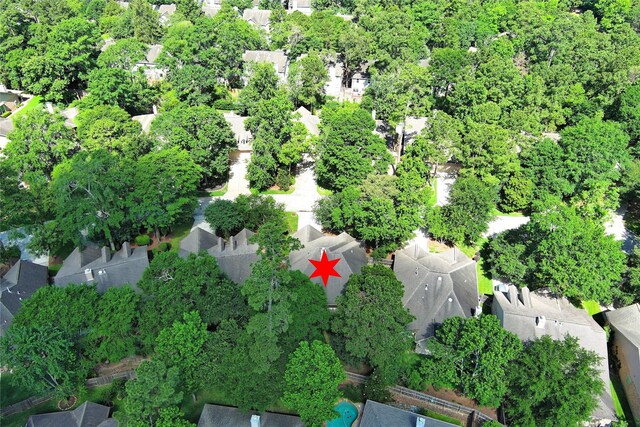 aerial view of property and surrounding area with nearby suburban area