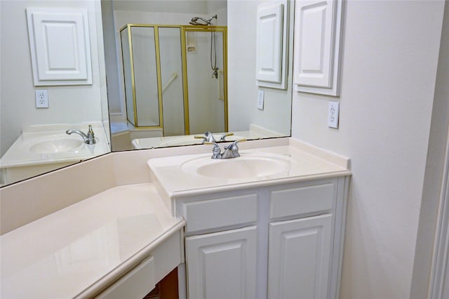 full bath with a shower stall and vanity