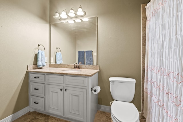 4609 Sharman St, Houston, TX 77009 - bathroom featuring toilet, vanity, baseboards, and tile patterned flooring