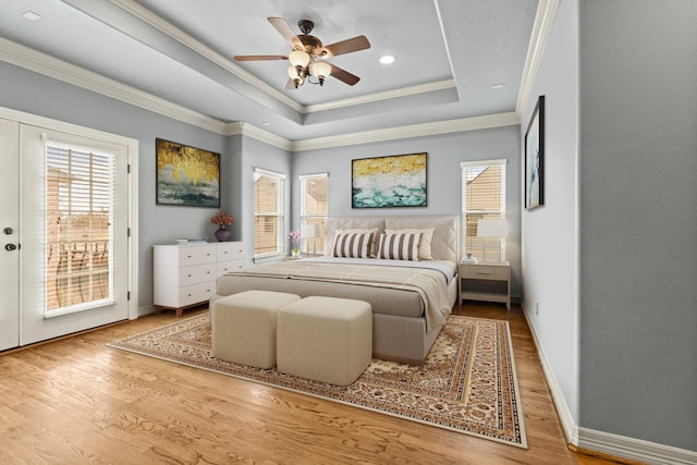 4609 Sharman St, Houston, TX 77009 - bedroom with a tray ceiling, ornamental molding, wood finished floors, access to outside, and baseboards