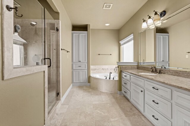 4609 Sharman St, Houston, TX 77009 - bathroom featuring a shower stall, vanity, a bath, and baseboards