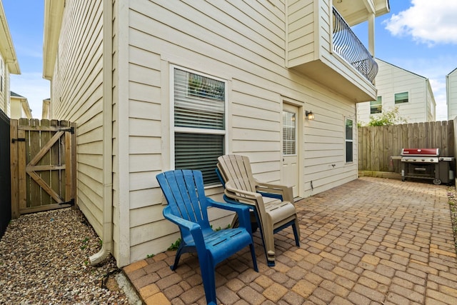 4609 Sharman St, Houston, TX 77009 - view of patio / terrace with grilling area, fence, a gate, and a balcony