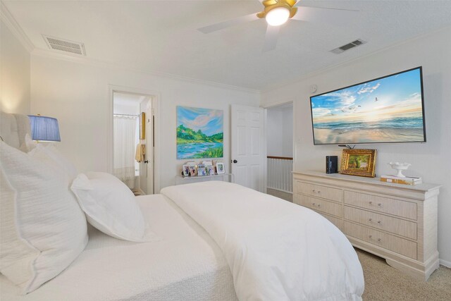 6475 Burgoyne Rd Unit 38, Houston, TX 77057 - bedroom with crown molding, light carpet, a ceiling fan, and ensuite bathroom