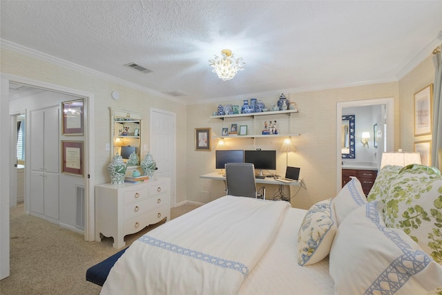 6475 Burgoyne Rd Unit 38, Houston, TX 77057 - bedroom with ornamental molding, carpet, an office area, ensuite bathroom, and a textured ceiling