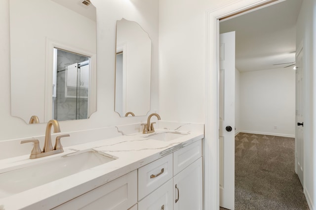 11623 Aspenway Dr, Houston, TX 77070 - bathroom featuring double vanity, an enclosed shower, and baseboards