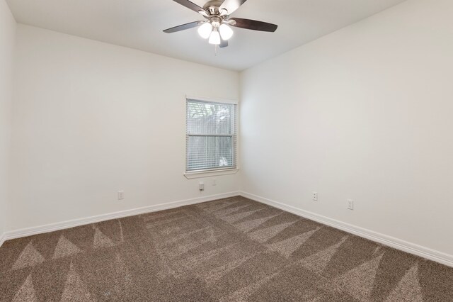 11623 Aspenway Dr, Houston, TX 77070 - spare room with dark colored carpet, baseboards, and a ceiling fan